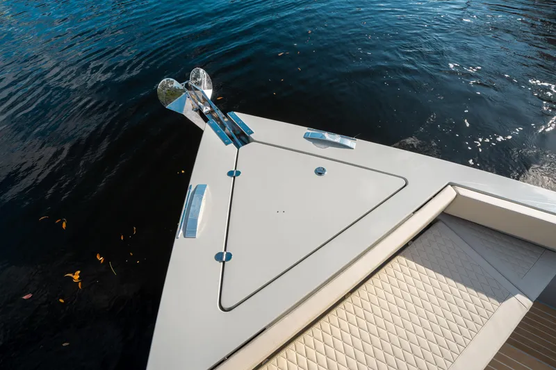 Slide: The Image of Bow of 2025 De Antonio Yachts D50 OPEN on water, featuring sleek design and anchor. - 32
