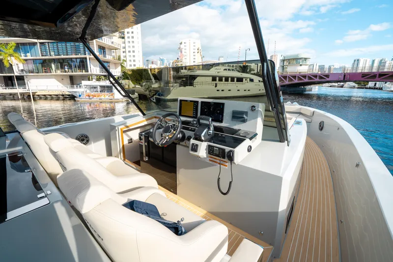 Slide: The Image of 2025 De Antonio Yachts D50 OPEN, luxury yacht interior with modern helm and waterfront view. - 38