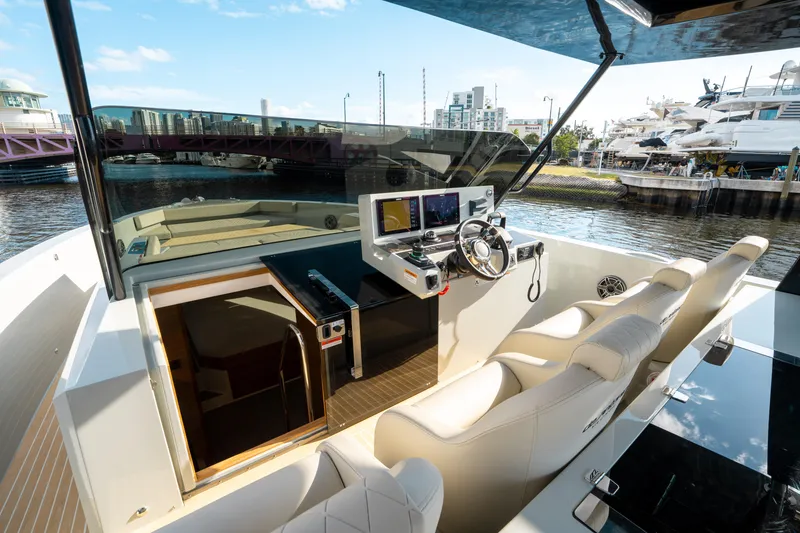 Slide: The Image of 2025 De Antonio Yachts D50 OPEN cockpit with modern controls and luxurious seating. - 39