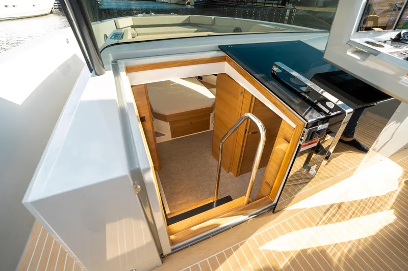 Slide: The Image of Interior view of 2025 De Antonio Yachts D50 OPEN, showcasing cabin entrance and modern design. - 41
