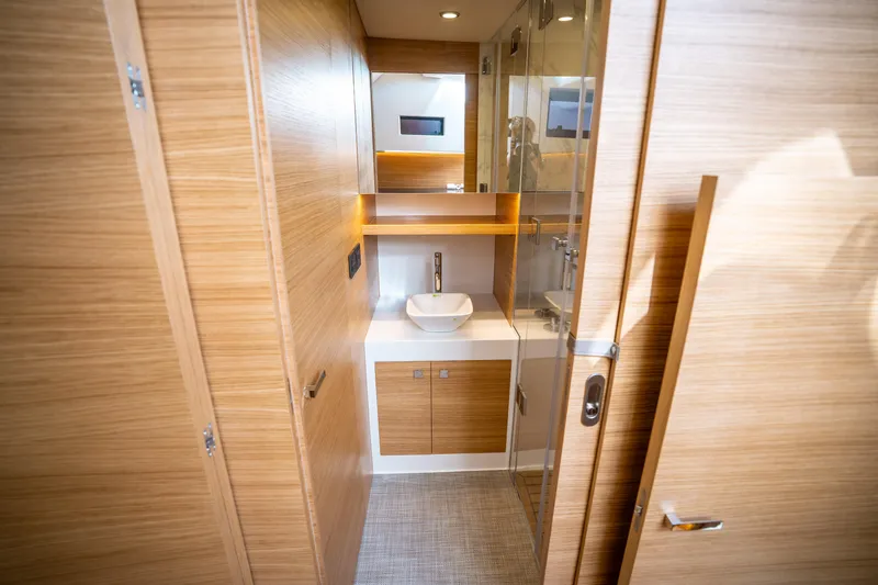 Slide: The Image of Luxurious bathroom interior of 2025 De Antonio Yachts D50 OPEN, featuring modern wood finishes. - 46