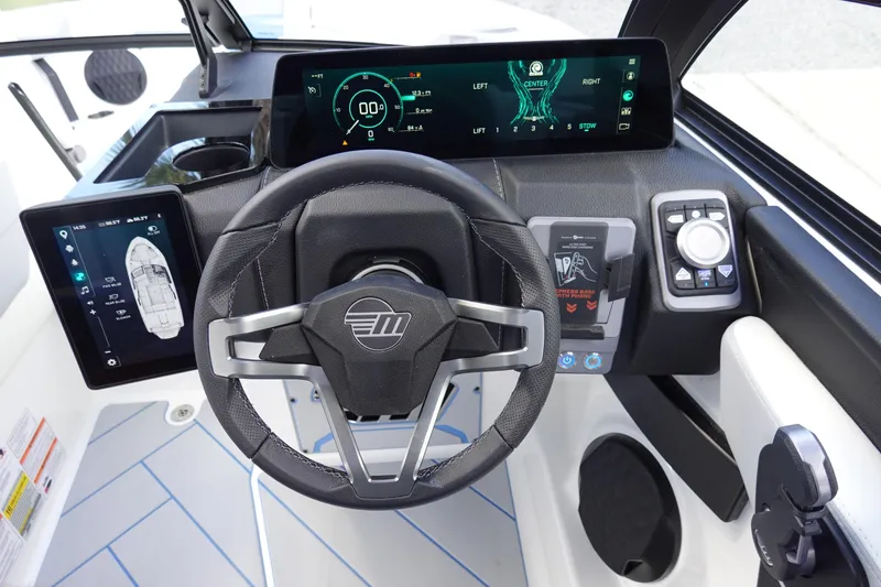 Slide: The Image of 2025 Malibu 23 LSV WAKESETTER dashboard with advanced digital controls and steering wheel. - 19