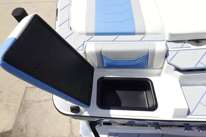 Slide: The Image of 2025 Malibu 23 LSV WAKESETTER boat interior with open storage compartment. - 31