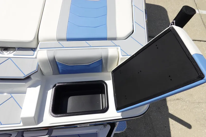 Slide: The Image of 2025 Malibu 23 LSV WAKESETTER boat interior with open storage compartment. - 32