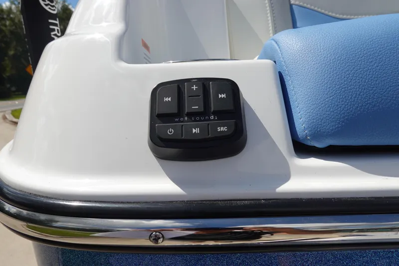 Slide: The Image of 2025 Malibu 23 LSV WAKESETTER audio control panel on boat interior. - 34