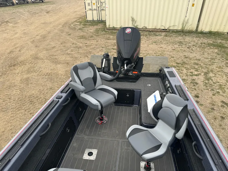 Slide: The Image of 2023 Warrior V2090 boat interior with two swivel seats and outboard motor. - 10