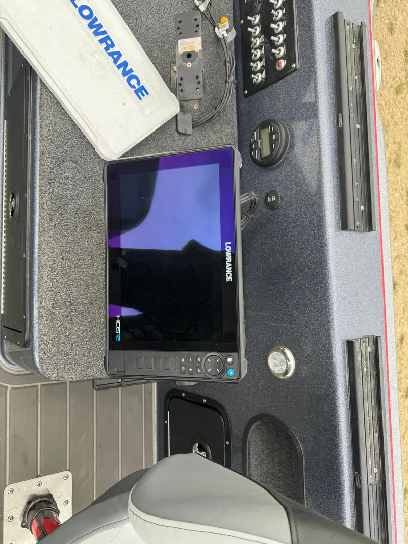 Slide: The Image of 2023 Warrior V2090 boat dashboard with Lowrance fishfinder and control panel. - 12