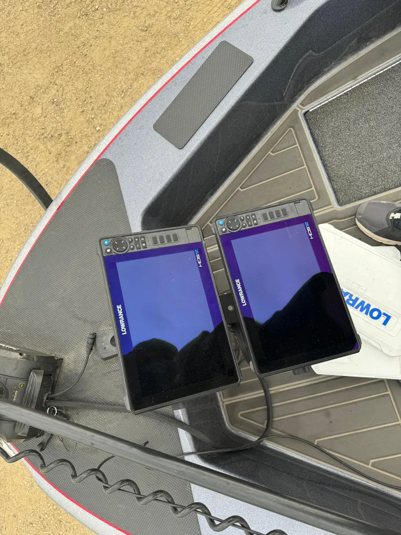 Slide: The Image of 2023 Warrior V2090 boat with dual Lowrance fish finders on deck. - 14