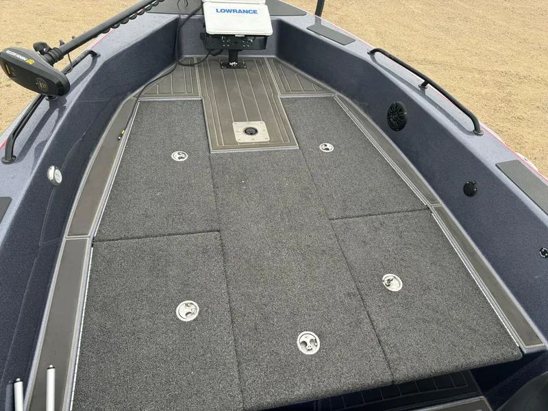 Slide: The Image of 2023 Warrior V2090 boat deck with Lowrance equipment, featuring spacious carpeted surface. - 6