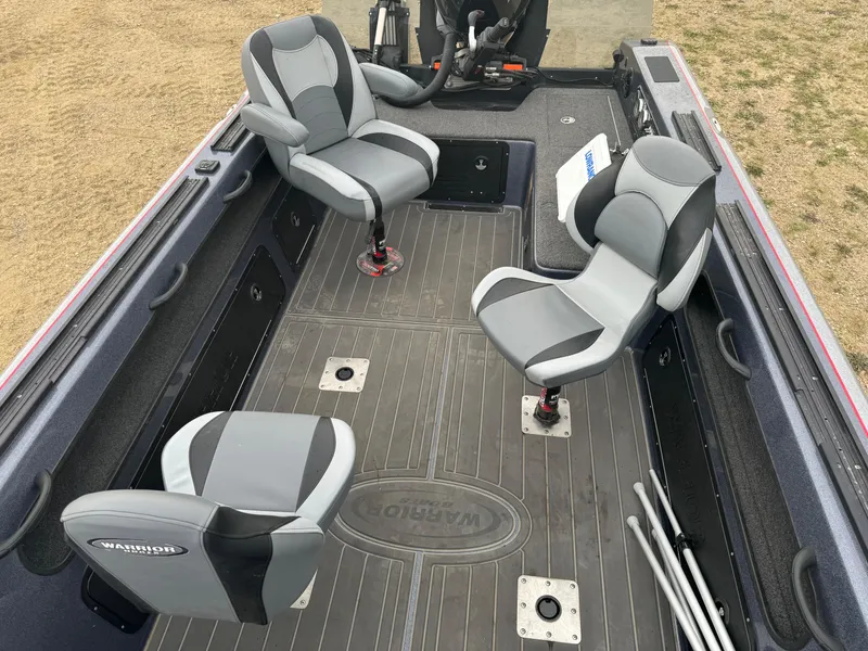 Slide: The Image of 2023 Warrior V2090 boat interior with gray seating and spacious deck. - 8