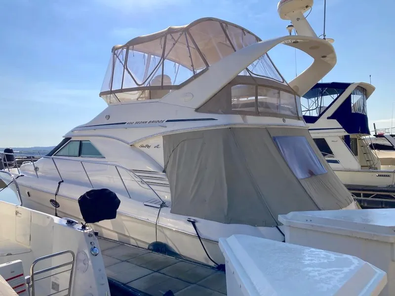 Slide: The Image of 2000 Sea Ray 400 Sedan Bridge yacht docked at marina. - 1