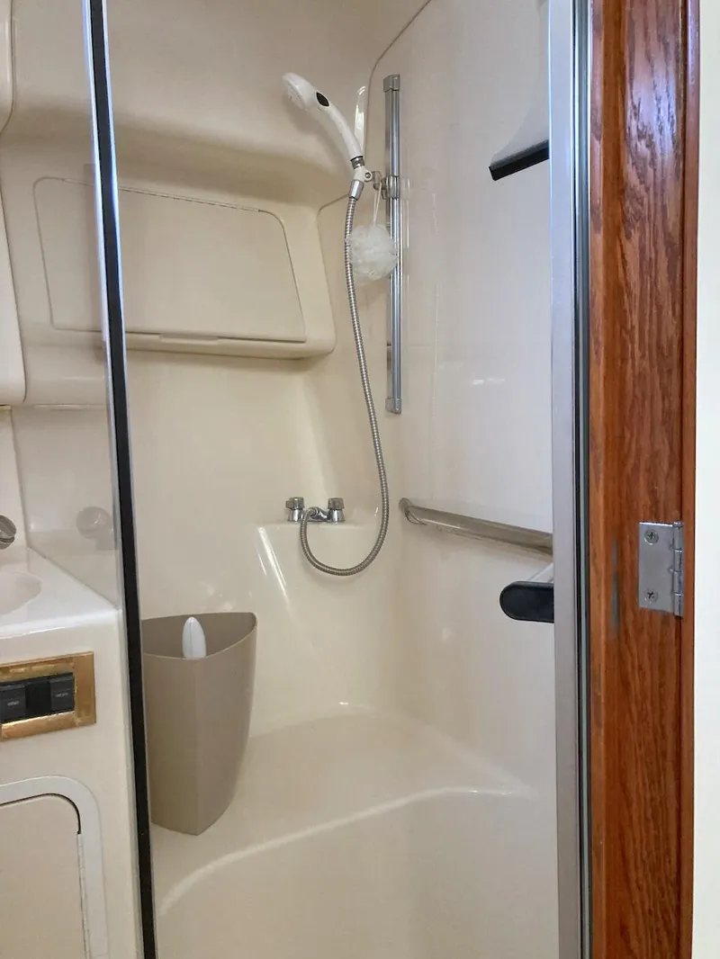 Slide: The Image of Shower area in 2000 Sea Ray 400 Sedan Bridge yacht, featuring modern fixtures. - 10