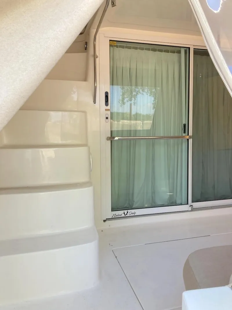 Slide: The Image of Sea Ray 400 Sedan Bridge 2000, interior stairs and sliding glass door. - 4