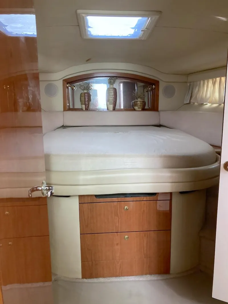 Slide: The Image of Luxurious bedroom interior of 2000 Sea Ray 400 Sedan Bridge yacht. - 8