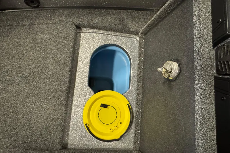 Slide: The Image of 2024 Nitro ZV20 boat compartment with yellow cap and blue interior. - 10