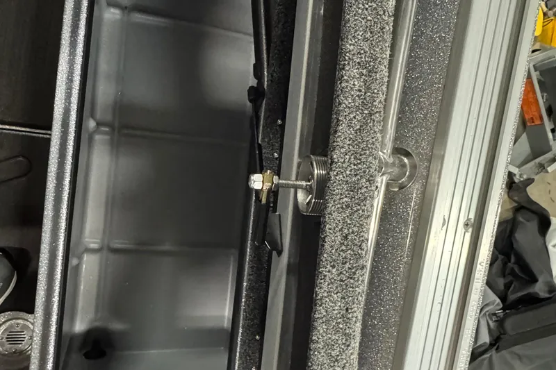 Slide: The Image of 2024 Nitro ZV20 boat interior detail with metal and carpeted components. - 11