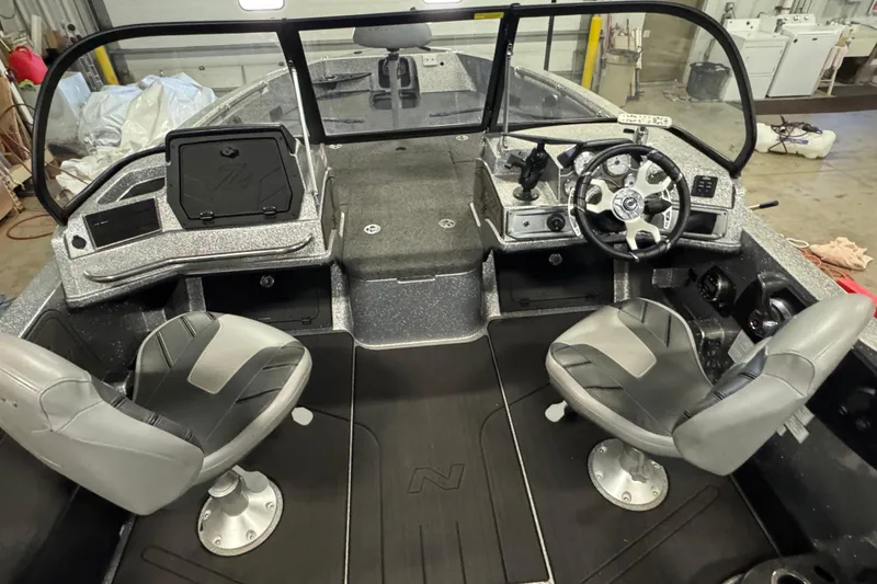 Slide: The Image of 2024 Nitro ZV20 boat interior with dual seats and steering console. - 13