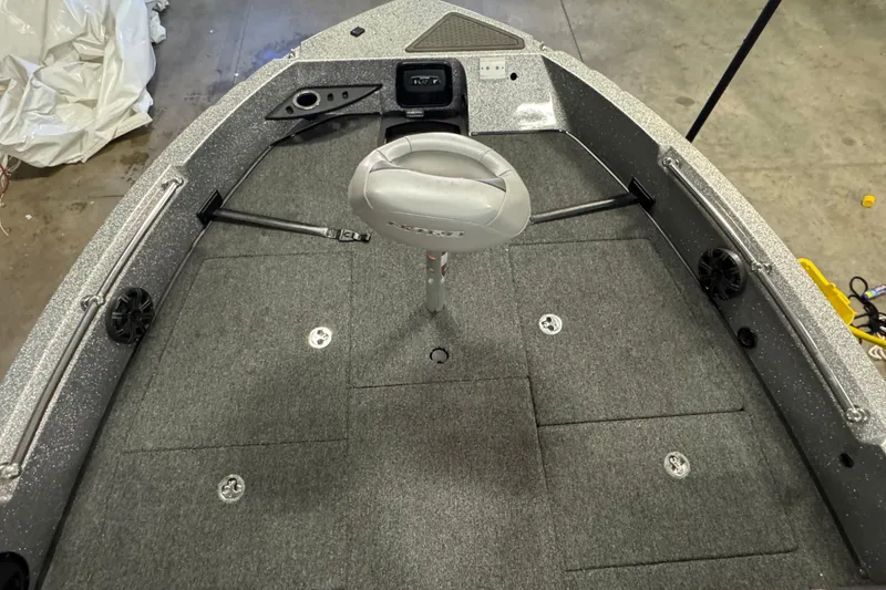 Slide: The Image of 2024 Nitro ZV20 boat interior with gray carpet and central seat. - 15