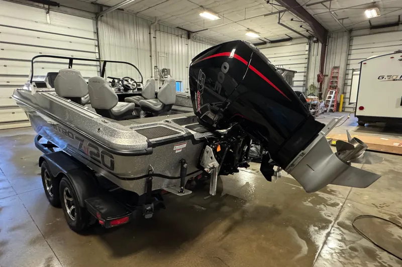 Slide: The Image of 2024 Nitro ZV20 boat with powerful outboard motor in a garage setting. - 4