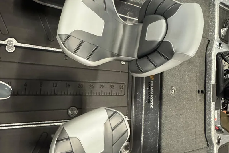 Slide: The Image of 2024 Nitro ZV20 boat interior with Minn Kota equipment and measuring ruler. - 7