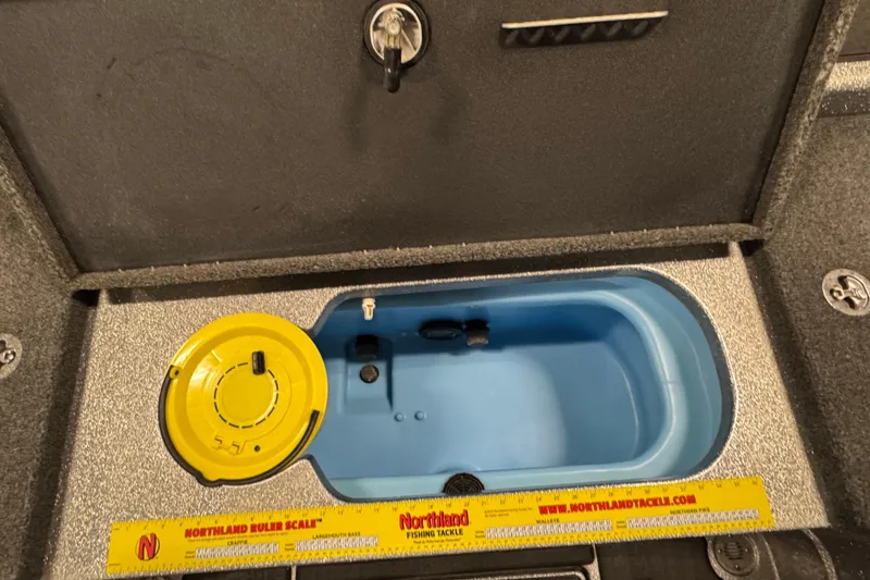 Slide: The Image of 2024 Nitro ZV20 boat livewell with Northland ruler scale and yellow lid. - 9