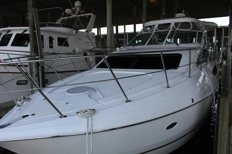 Slide: The Image of 2005 Cruisers 455 Express Motor Yacht docked in marina. - 1