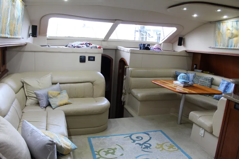 Slide: The Image of Luxurious interior of 2005 Cruisers 455 Express Motor Yacht with plush seating and elegant decor. - 16