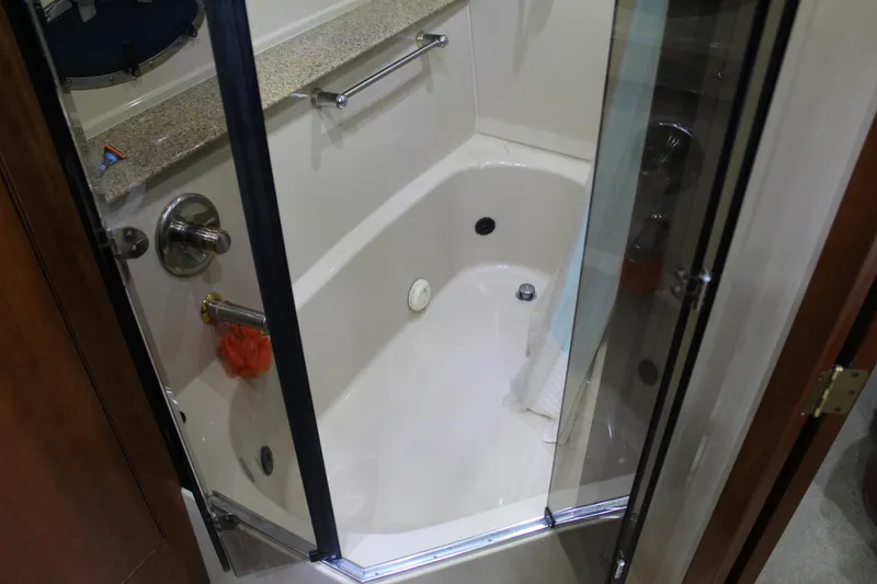 Slide: The Image of Bathroom of 2005 Cruisers 455 Express Motor Yacht with shower and glass door. - 25