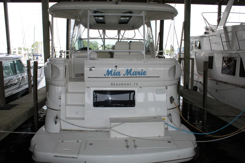Slide: The Image of 2005 Cruisers 455 Express Motor Yacht docked in marina, rear view. - 3