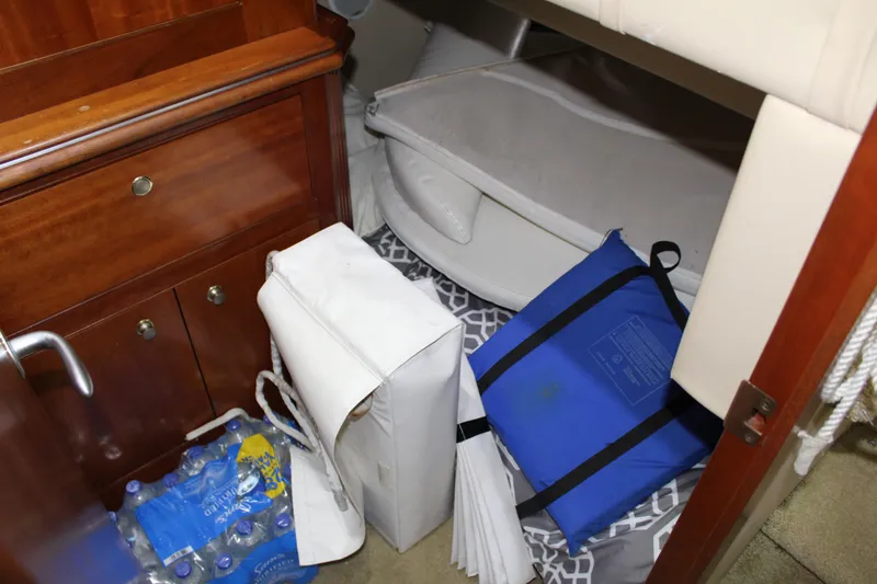 Slide: The Image of Storage area in 2005 Cruisers 455 Express Motor Yacht with supplies and bags. - 30
