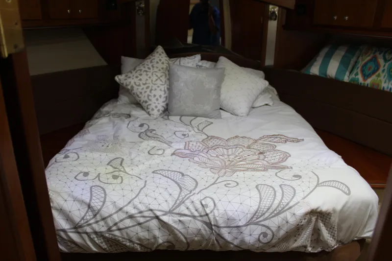 Slide: The Image of Luxurious 2005 Cruisers 455 Express Motor Yacht bedroom with elegant bedding and pillows. - 35