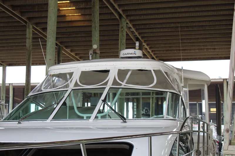 Slide: The Image of 2005 Cruisers 455 Express Motor Yacht under covered dock with Garmin equipment. - 7