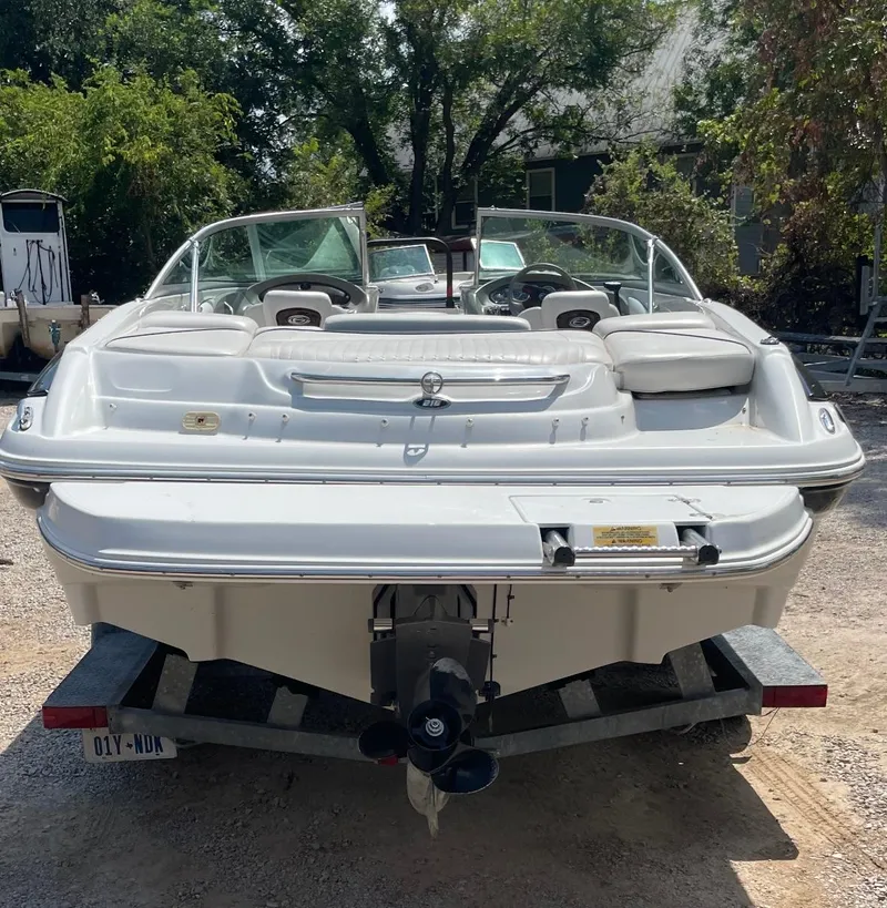 Slide: The Image of 2005 Crownline Runabout boat on trailer, rear view, outdoors. - 2