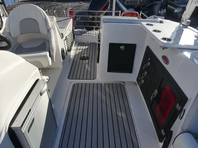 Slide: The Image of 2023 Caravelle Powerboats 251 XL interior with modern seating and dashboard. - 12