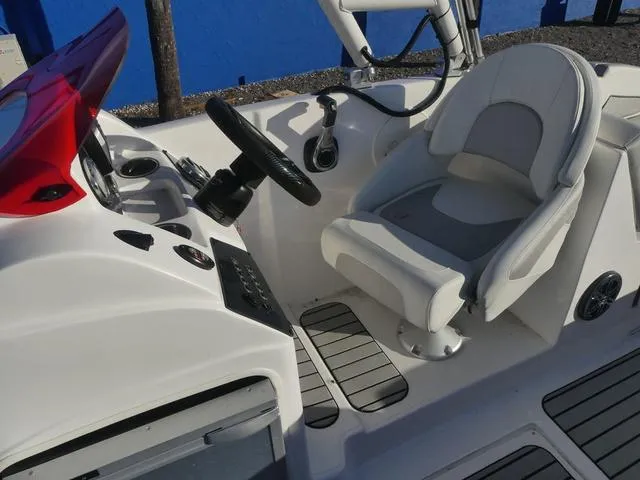 Slide: The Image of 2023 Caravelle Powerboats 251 XL interior with gray seating and deck. - 13