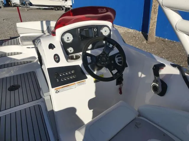 Slide: The Image of 2023 Caravelle Powerboats 251 XL storage compartment with cushioned seating. - 14