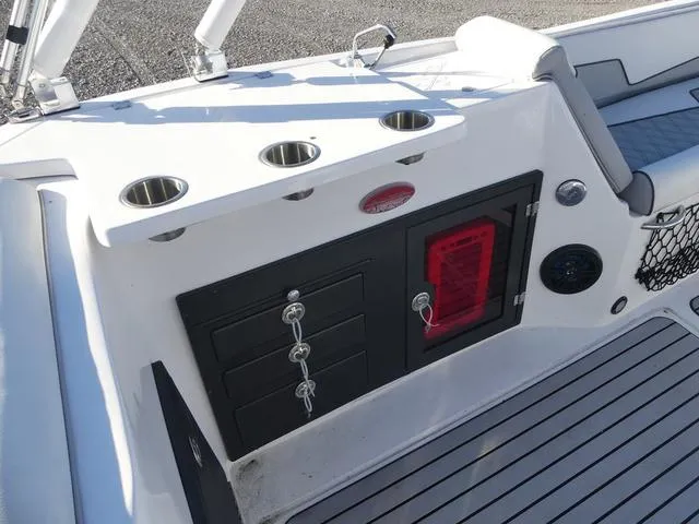 Slide: The Image of 2023 Caravelle Powerboats 251 XL storage compartment with open seating area. - 15