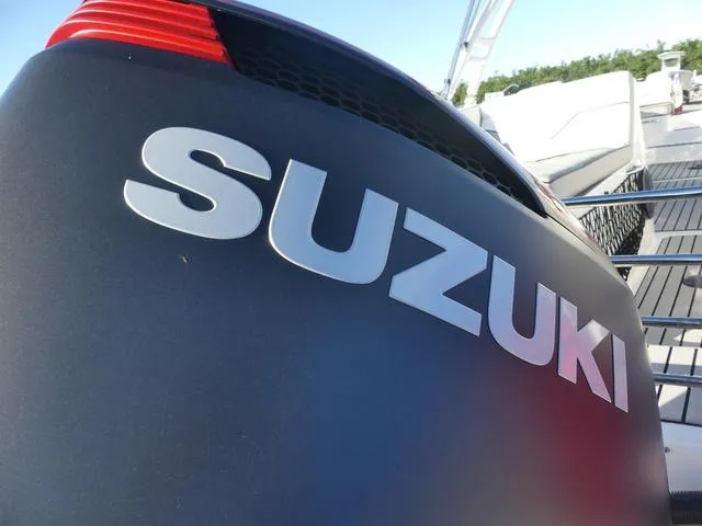 Slide: The Image of 2023 Caravelle Powerboats 251 XL with red safety gate on deck. - 20