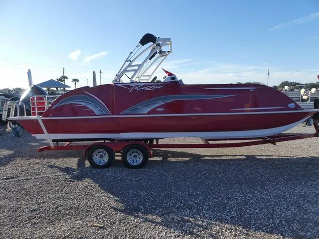 Slide: The Image of 2023 Caravelle Powerboats 251 XL on trailer, rear view, red and white design. - 5
