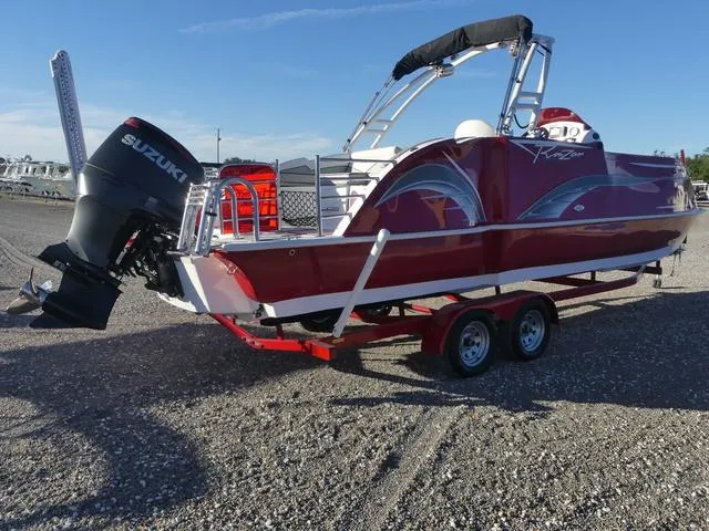 Slide: The Image of 2023 Caravelle Powerboats 251 XL in red on trailer, side view. - 6