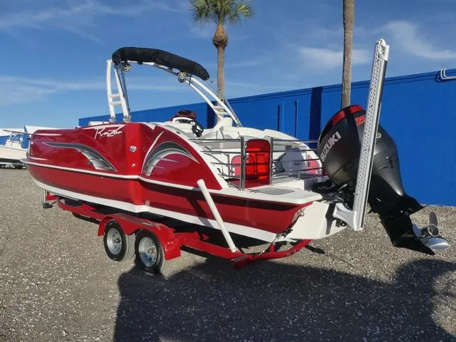 Slide: The Image of Red 2023 Caravelle Powerboats 251 XL on trailer, featuring Suzuki outboard motor. - 8