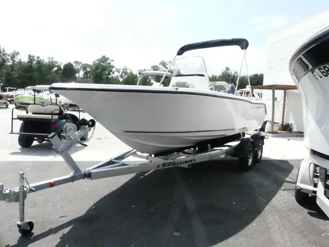 Slide: The Image of 2025 Key West 203 FS boat on trailer, parked outdoors. - 3