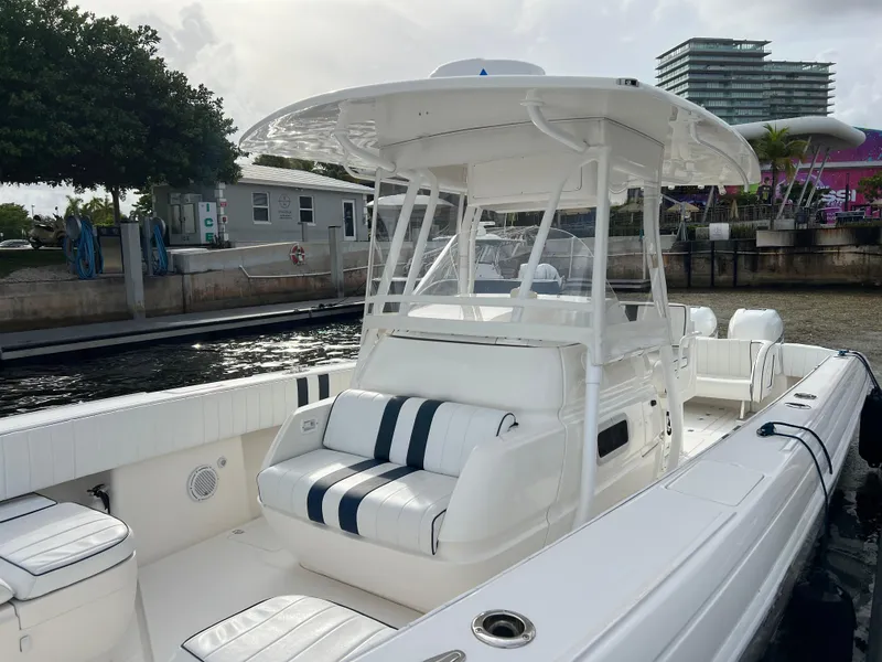 Slide: The Image of Intrepid 350 Open boat, 2008 model with 2020 engines, docked near waterfront buildings. - 22