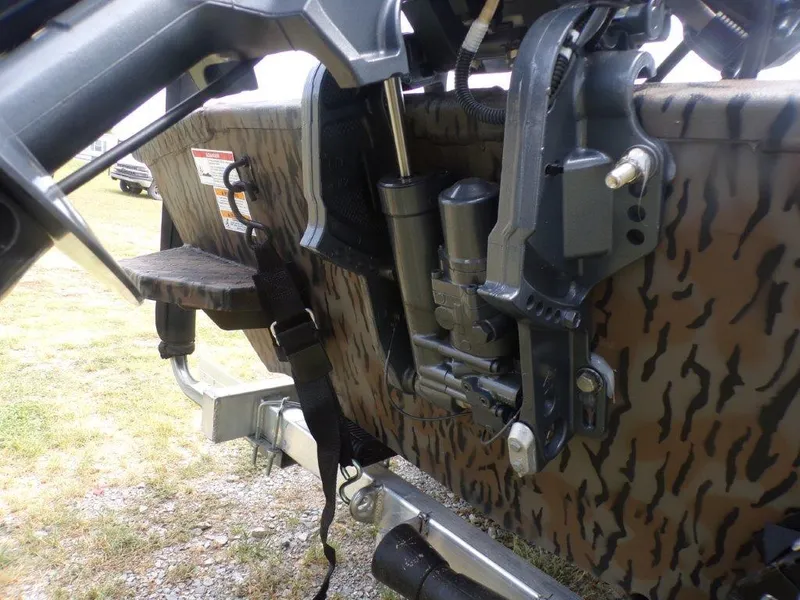 Slide: The Image of 2024 Xpress HD15DBX boat motor mount with camouflage pattern. - 2