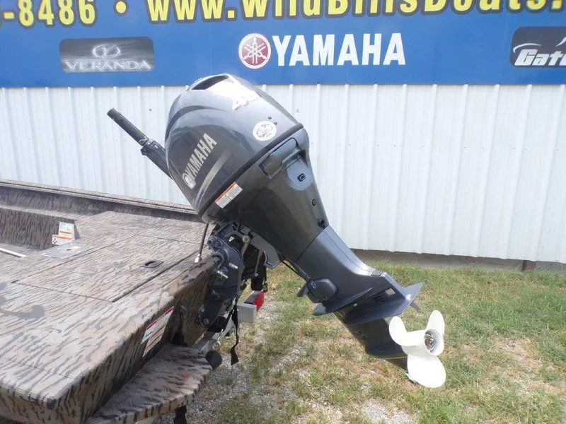 Slide: The Image of 2024 Xpress HD15DBX boat with Yamaha outboard motor displayed outdoors. - 3