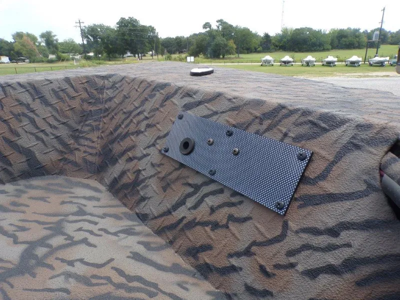 Slide: The Image of 2024 Xpress HD15DBX boat interior with camouflage design and mounted panel. - 4