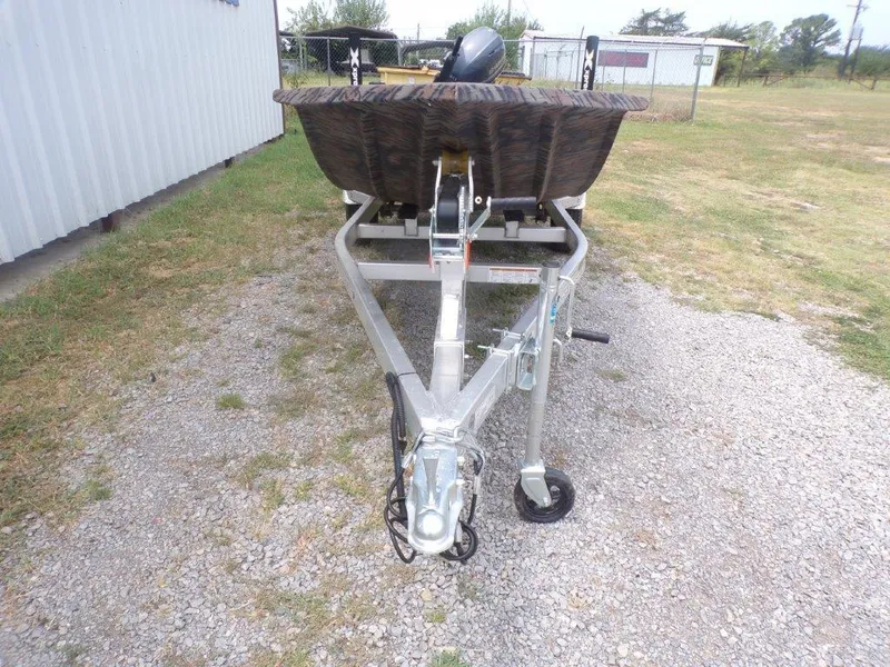 Slide: The Image of 2024 Xpress HD15DBX boat trailer on gravel driveway. - 8