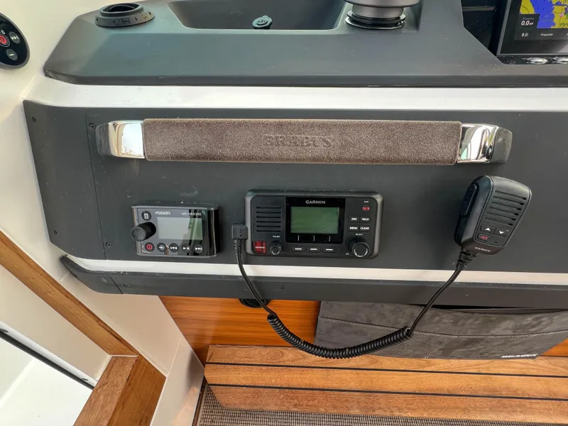 Slide: The Image of Axopar 28 CABIN 2020 dashboard with Garmin radio and control panel. - 15