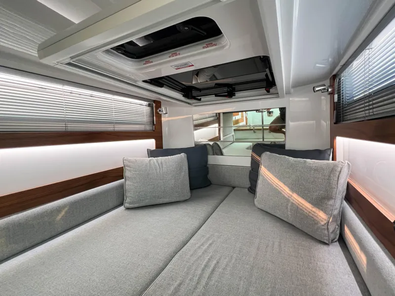 Slide: The Image of Interior of 2020 Axopar 28 CABIN with modern seating and sleek design. - 19