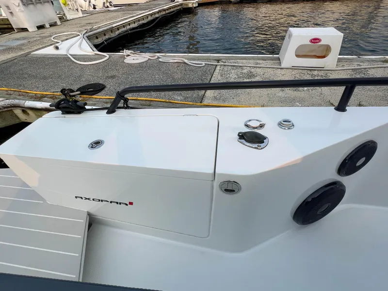 Slide: The Image of 2020 Axopar 28 CABIN boat docked, showcasing sleek design and modern features. - 25